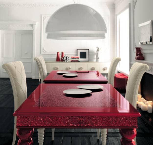 red dining table with dark wood floors