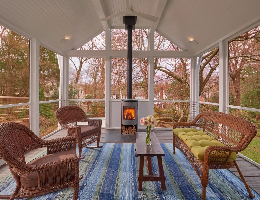 screened in porch with wood fireplace 1