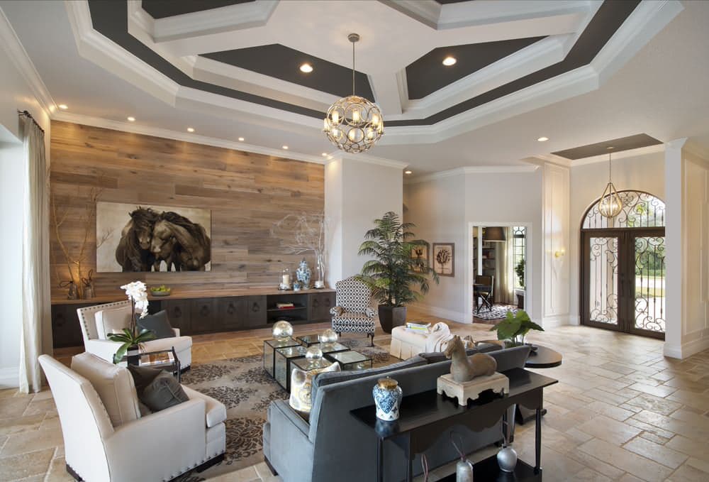 accent wall living room with chandelier