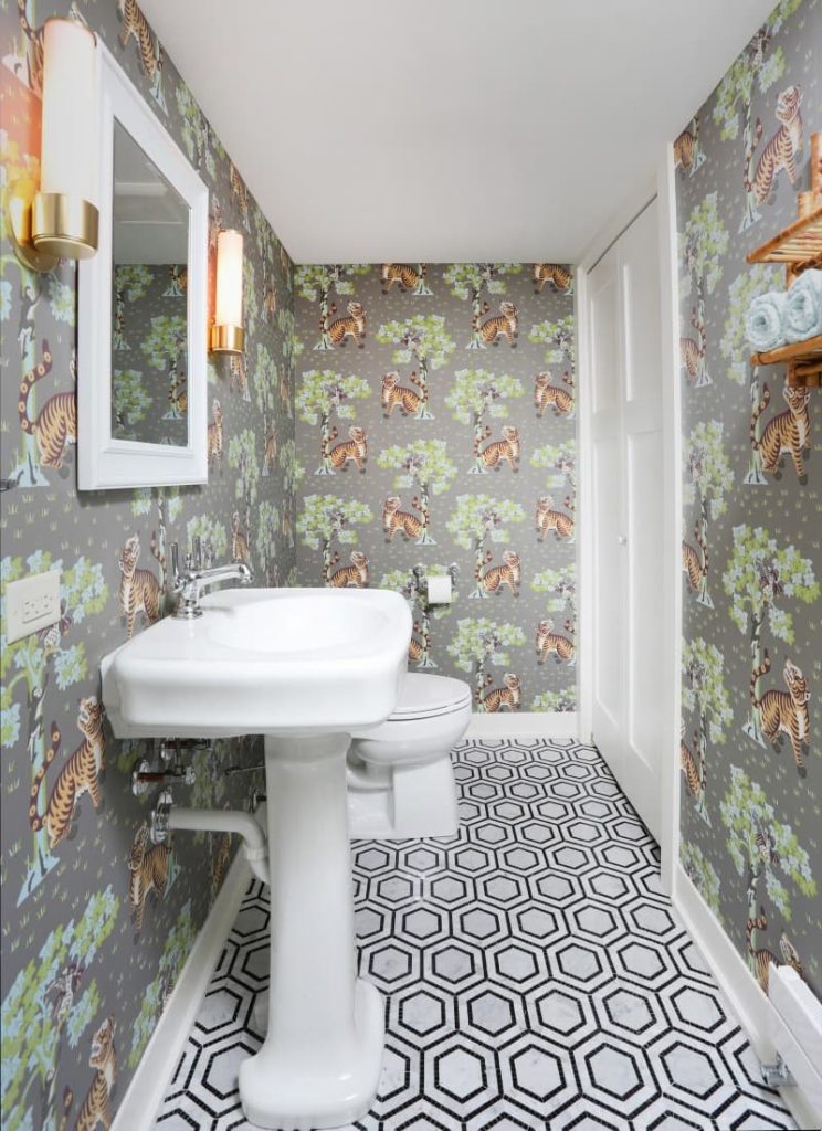 basement bathroom with wallpaper