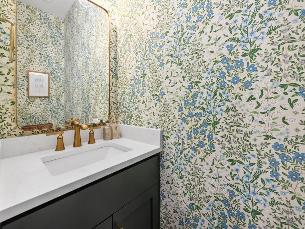 bathroom with accent wall with wallpaper 1