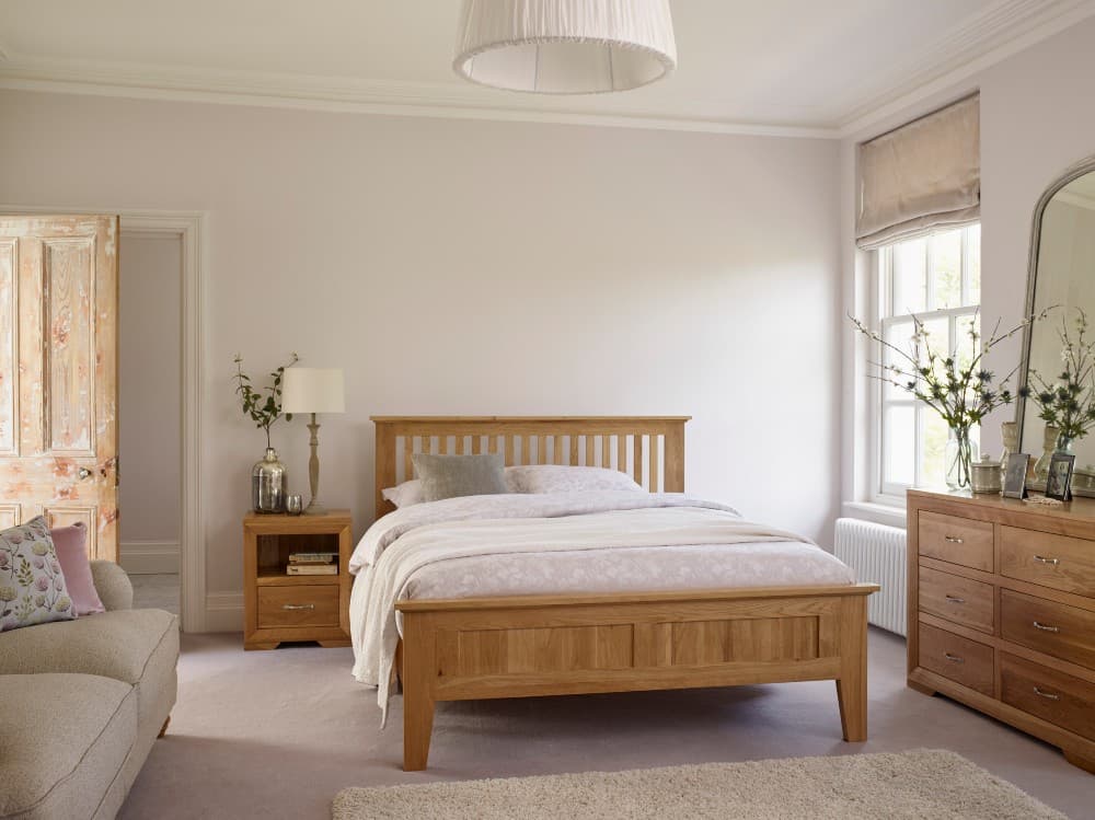 beige bedding with oak furniture