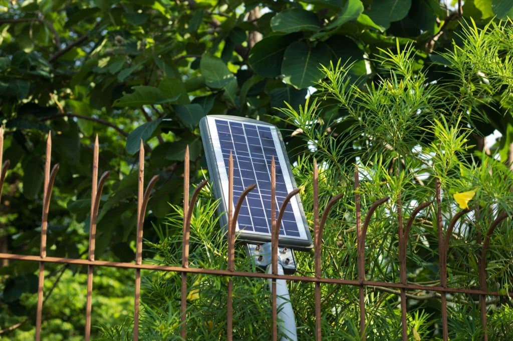 fence beside solar panel