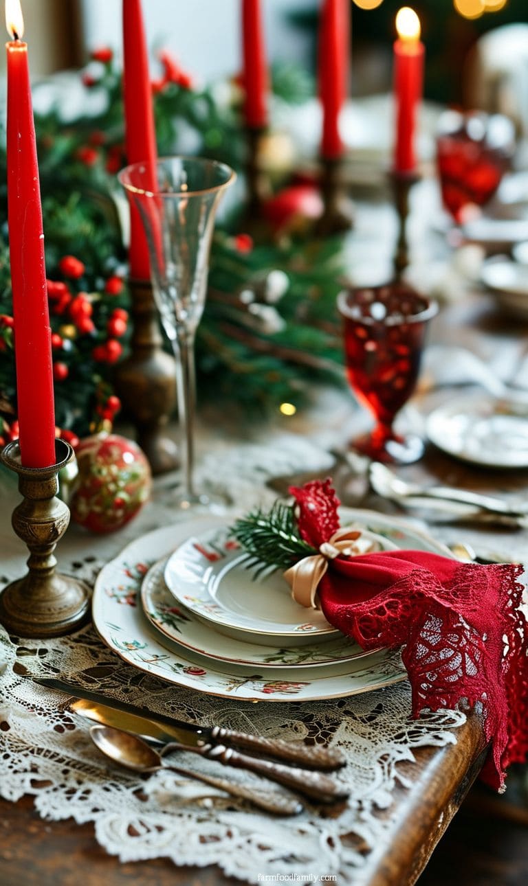 Traditional Christmas table with vintage china, red taper candles, and lace napkins tied with ribbon.