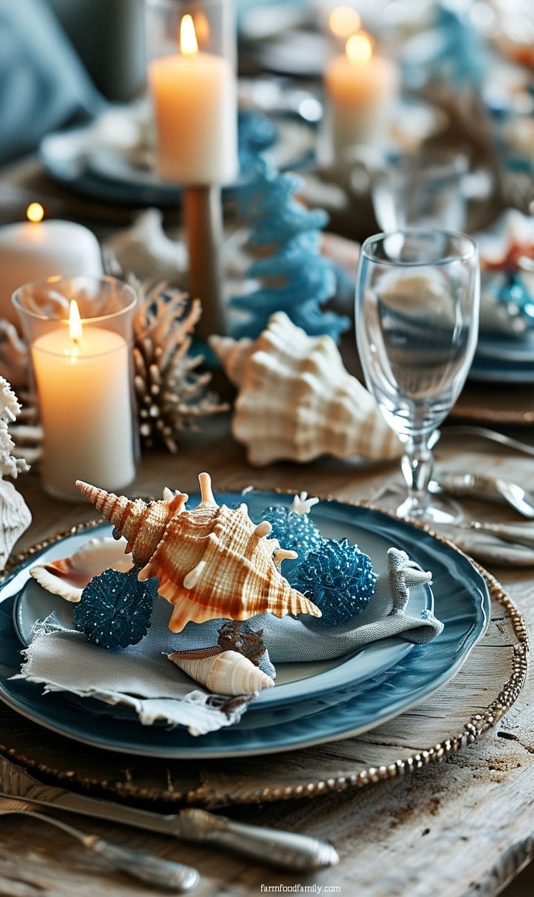 A coastal Christmas table featuring seashell accents, blue and white color palette, and coral-inspired decor.